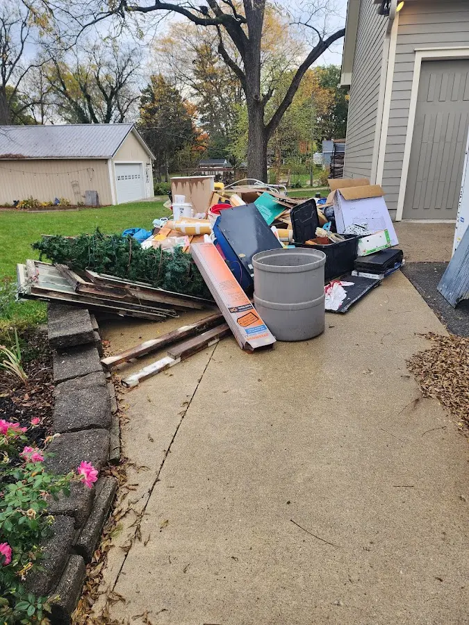 Dumpster being loaded with debris for 3 Yard Dumpster Rental in Haverhill